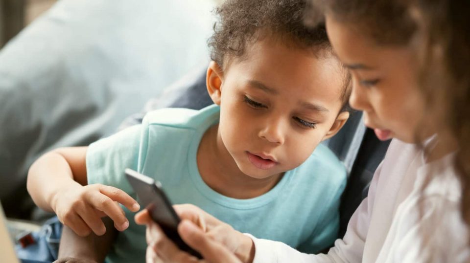 Interested African American Children Using Smartphone Phones For Kids Ss Featured