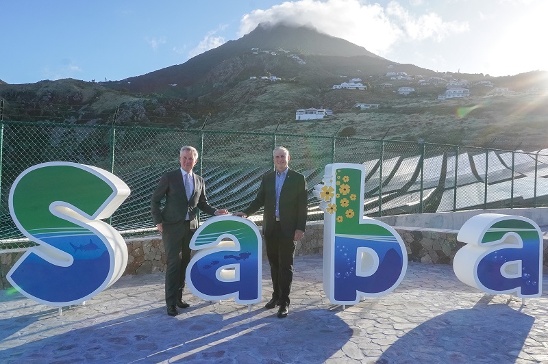 State Secretary Van Der Burg And Island Governor Johnson At Saba Sign.01